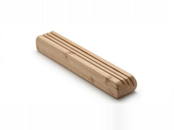 Empty wooden playing card holder made from fir, showing natural wood grain, beveled edges and three parallel card slots on a white background.