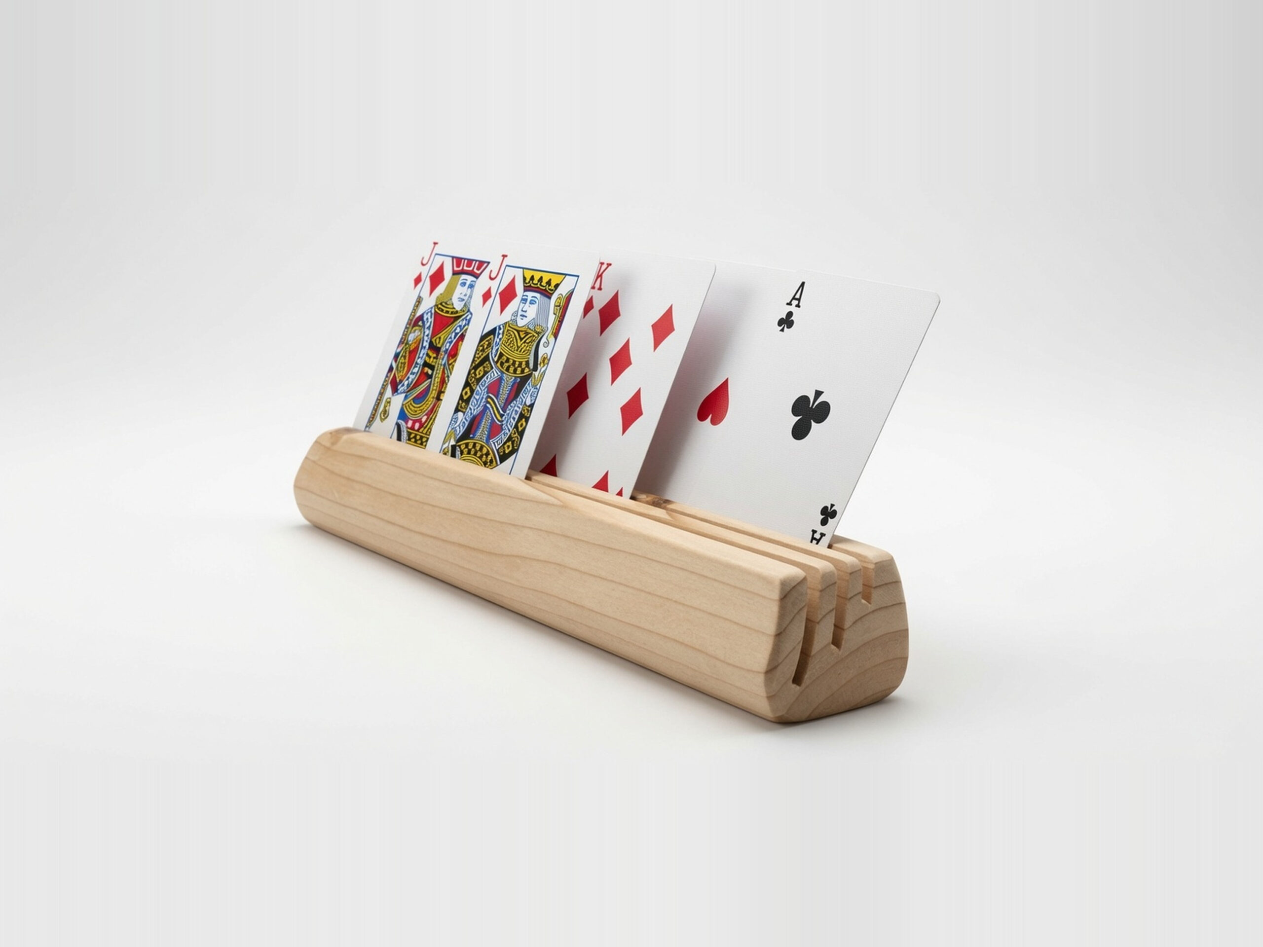 Three-quarter front view of a wooden playing card holder made from fir, with face-up playing cards spread across three angled slots.