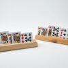 Two wooden playing card holders made from fir, showing the three-slot tiered card rack design.